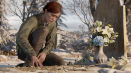 Ellie en train de fleurir la tombe d'un proche, dans The Last of Us Part II.